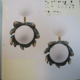 white beads and brass earrings